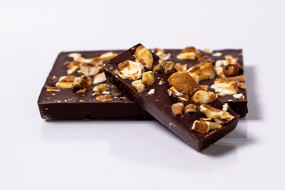 Pieces of delicious organic Coconut Caramel & Crushed Cashew Bark chocolate bar
